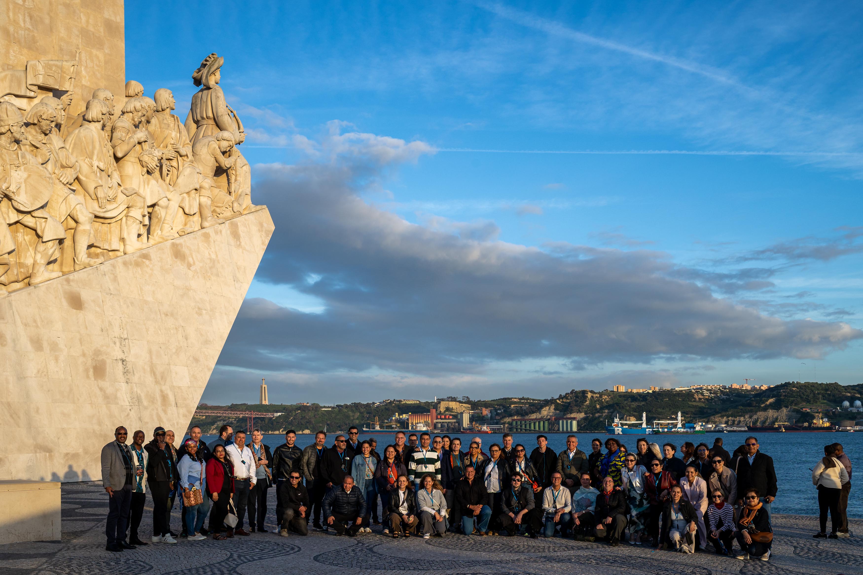 Delegates photographed beside the Monument to the Discoveries